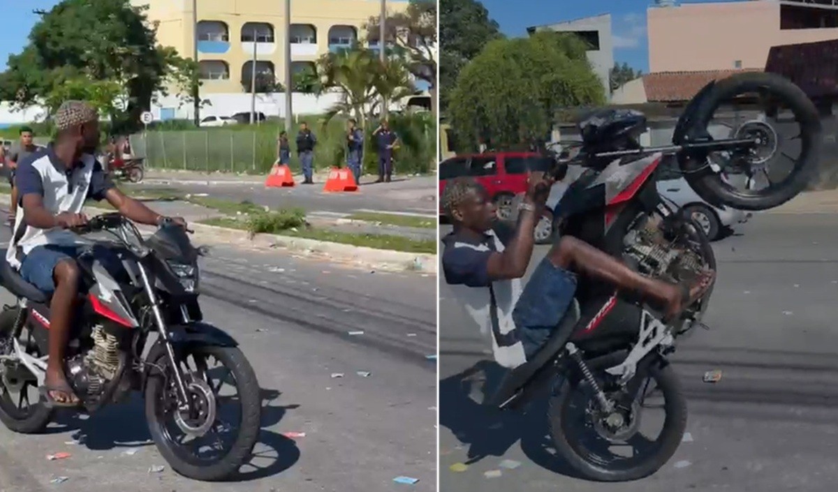 Motociclista sem capacete empina moto perto de agentes e eleitores em local de votação de Campos